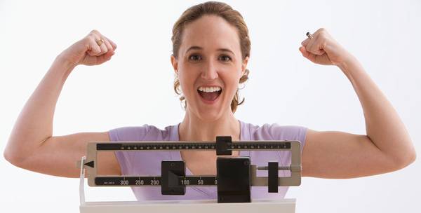 Happy Woman after losing weight on The HcG Diet