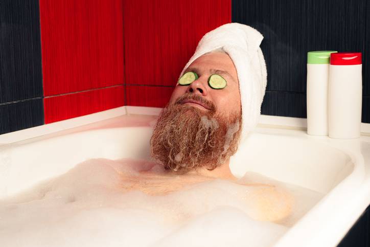 man relaxing in bath